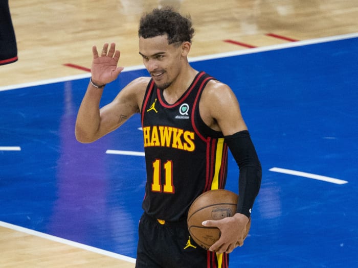 Atlanta Hawks guard Trae Young (11) reacts with fans in the closing seconds of a victory against the Philadelphia 76ers in game seven of the second round of the 2021 NBA Playoffs